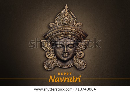 Happy Navratri, Durga Pooja, Maa Durga face in Metal  Royalty-Free Stock Photo #710740084