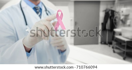Doctor touching an digital screen  against mri scanner in room