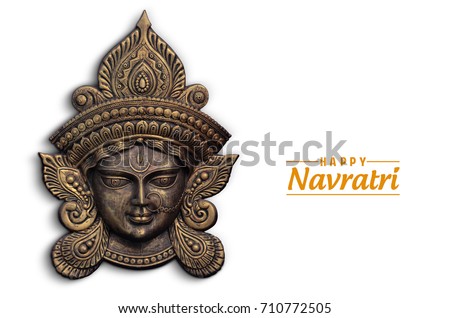 Happy Navratri, Durga Pooja, Maa Durga Face in Metal Royalty-Free Stock Photo #710772505