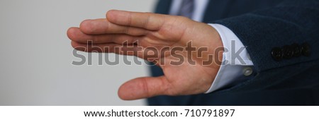 Gesture male hand rejection says no male businessman in a suit on a gray background I will not categorically claim Royalty-Free Stock Photo #710791897