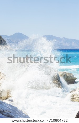 Rough sea and furious waves smack into the rocks at the beach of Cala Goloritzè, Sardinia, Italy. 