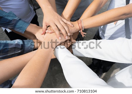 Team work concept. Business people joining hands