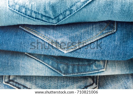 Stack of blue jeans closeup