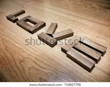 Vintage tone of love letter ordered on wooden pattern floor in diagonal direction