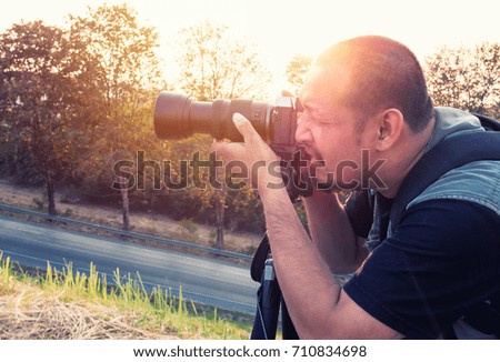 Photographer at sunset
