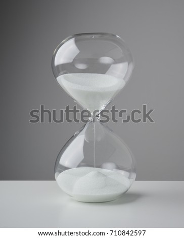 Studio photo of a hourglass,sand clock, business time management concept .