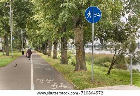 Footpath for hiking along the river. The path is divided for pedestrians and cyclists.