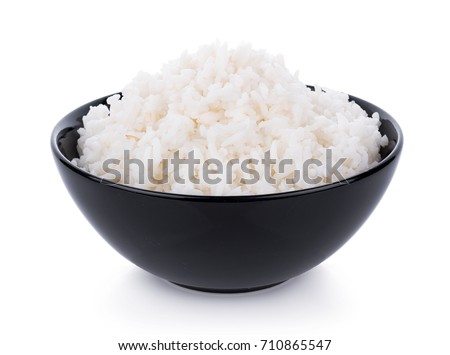Rice in a bowl on a white background Royalty-Free Stock Photo #710865547