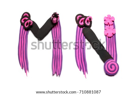 Plasticine letters M and N. Color plasticine alphabet, isolated on white background. Pink and black color of the alphabet. Emo style