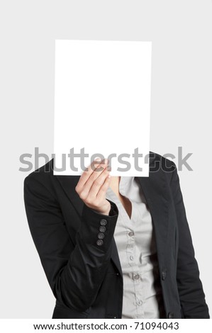 Woman showing a blank paper sheet in front of her head