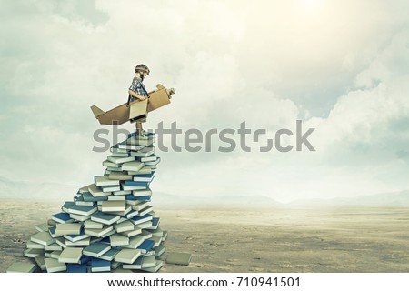 little aviator on 3d books Royalty-Free Stock Photo #710941501