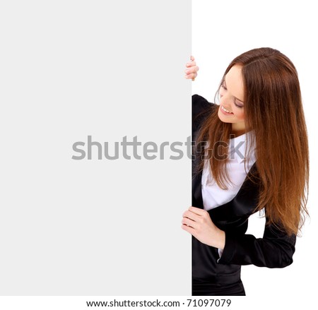 Isolate of a business woman standing beside a blank board