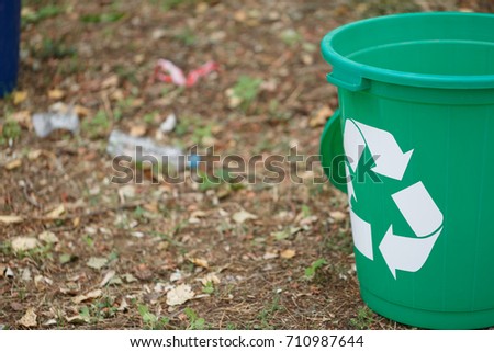 Colorful recycling bin on a ground background. Containers for garbage recycling. Environment, ecology, recycling concept.