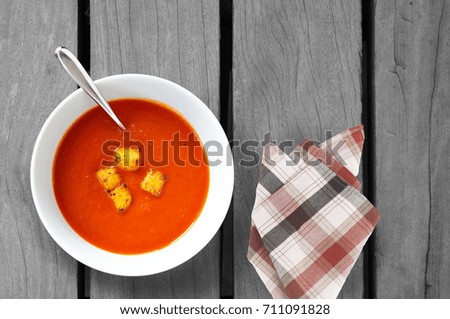 croutons soup on wooden table