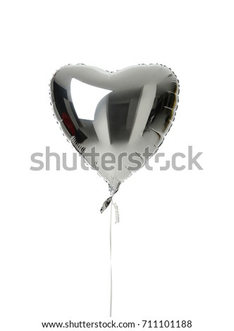 Single silver big heart metallic balloon for birthday isolated on a white background