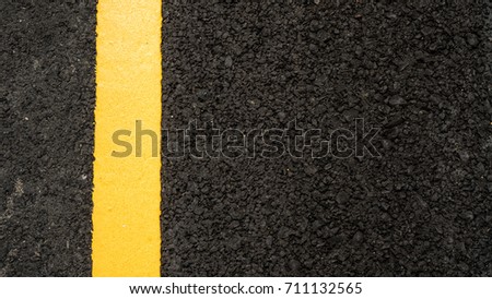 Yellow line on road texture abstract background. Copy space of transportation concept.