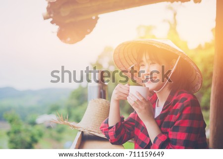 Portrait of attractive young asian woman drinking coffee