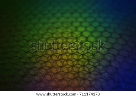 abstract background from plastic wrapper with colorful  dark light
