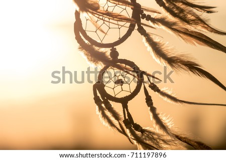 Dream Catcher on the sunset background Royalty-Free Stock Photo #711197896
