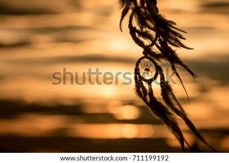 Dream Catcher on the sunset background Royalty-Free Stock Photo #711199192