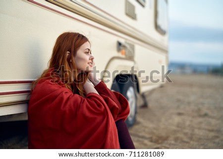 outdoor recreation, woman in a red plaid sitting at the van, summer                               