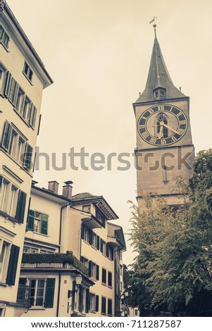  Clock tower of St. Peter church, Zurich, Switzerland. Vintage toned photo, old style effect