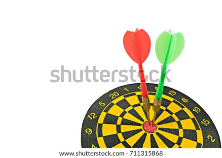 Darts board with arrows in the center of dartboard isolated on white.