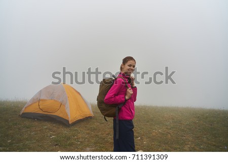 hiking, woman with a backpack, traveler, foggy weather, tent, three, hiking in the mountains                               