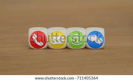 Colored contact us symbols on cubes