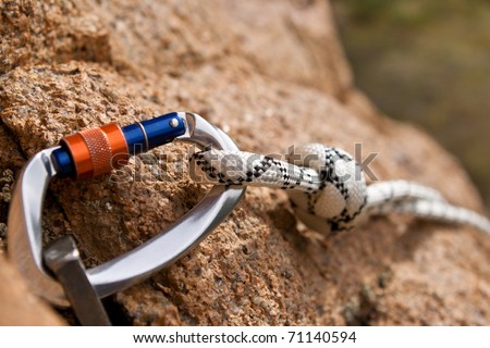 Carbine and hook with rope in stone Royalty-Free Stock Photo #71140594