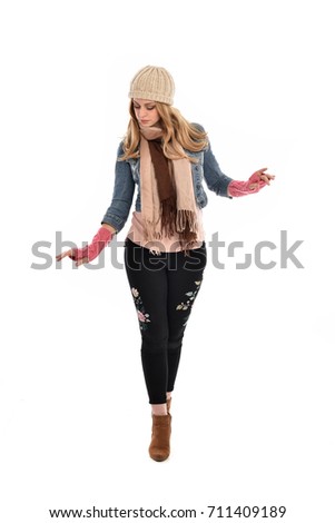 full length portrait of cute girl wearing fall fashion outfit, standing pose on white background