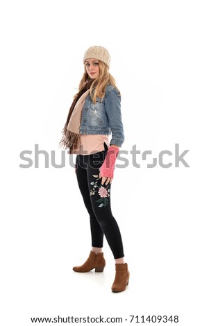full length portrait of cute girl wearing fall fashion outfit, standing pose on white background