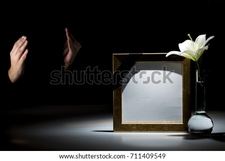 Blank mourning frame with praying hand and lilly flower for sympathy card 