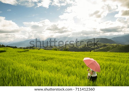 Woman relaxing in rice terraces on holiday