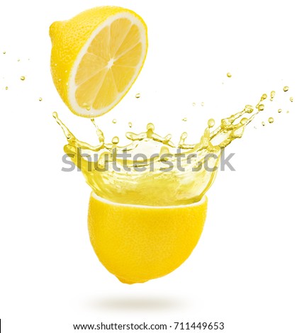 yellow juice splashing out of a lemon isolated on white Royalty-Free Stock Photo #711449653