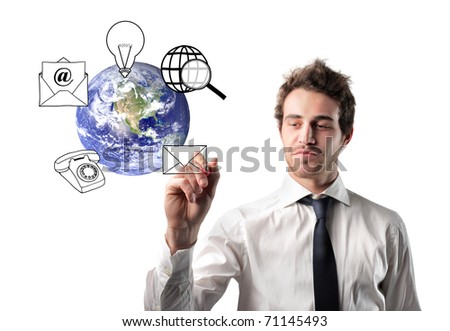 Businessman drawing communication symbols around the earth