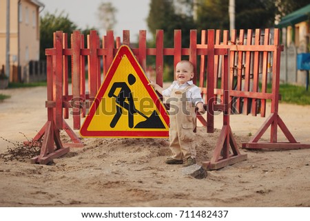 little boy on the repaired road