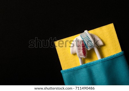 Toothbrushes under a blanket, on a black background
