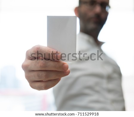 Hand hold blank white card mockup. Plain call-card mock up template holding arm. Plastic credit namecard display front. Check offset card design. Business branding.