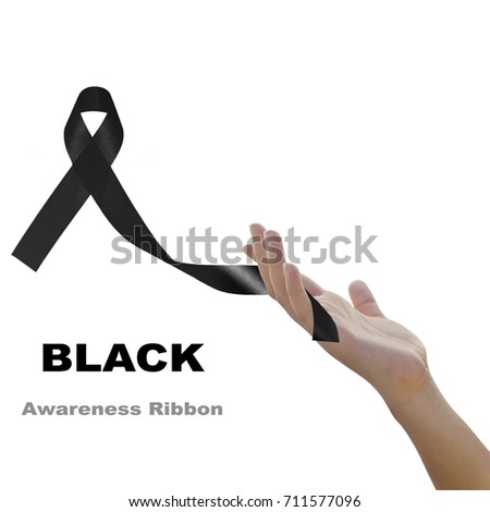 Woman hand holding black  ribbon  against white background for Melanoma and mourning concept