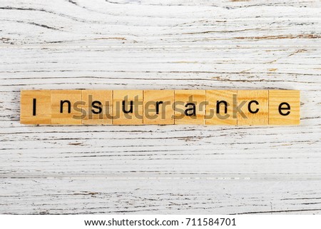 Insurance word made with wooden blocks concept