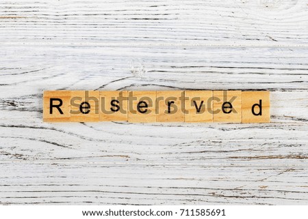 RESERVED word made with wooden blocks concept
