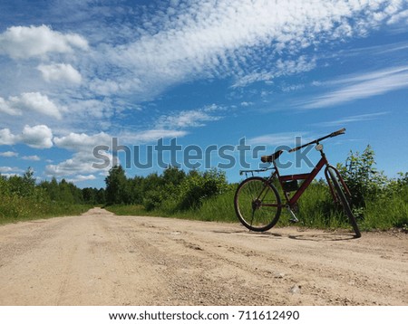 Bike on a gravel road in a scenic countryside nature. Sport and travel with bike.