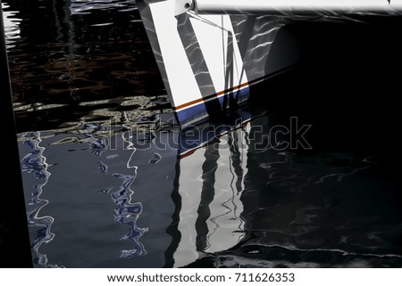 Boat stern reflecting in the ocean with beautiful colours
