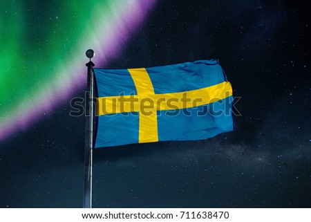 Finland flag over milky way and northern light