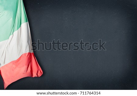 Close-up of Italian flag on a blackboard