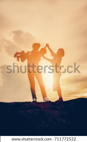 Silhouette happy family at sunset, parents, children Love affair concept Holiday hobby Family activities