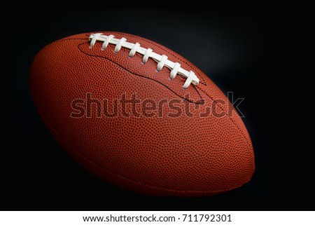 American football shooting in studio drak black background. 