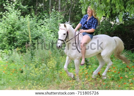 Beautiful blonde and her horse