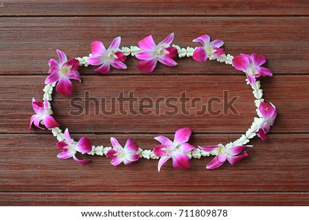 Welcome orchids garland on wood